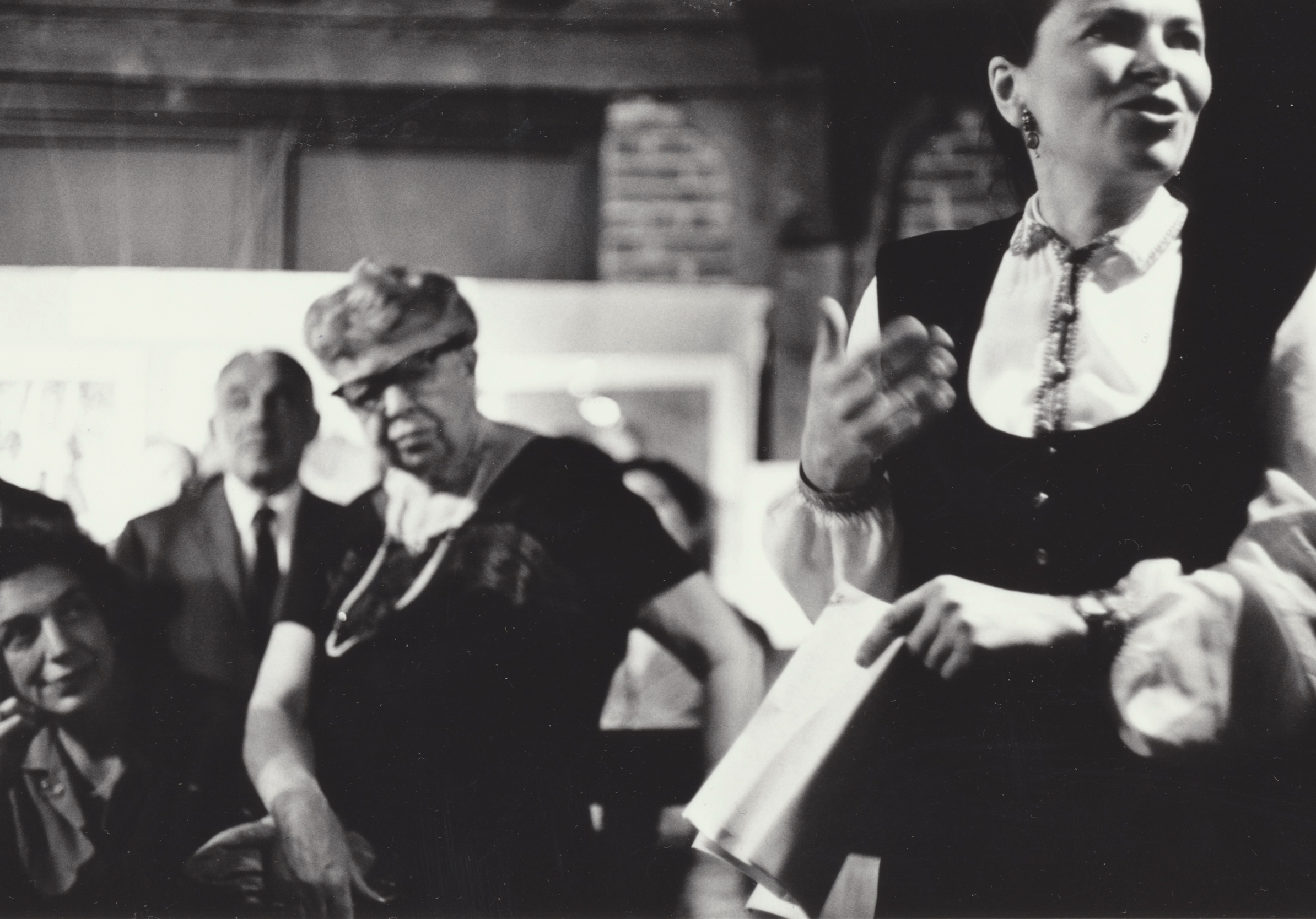 A speaker addressing a crowd at an exhibition